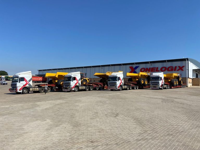 Abnormal load transport with escort vehicles by OneLogix Mega, ensuring safe and efficient delivery of oversized cargo.