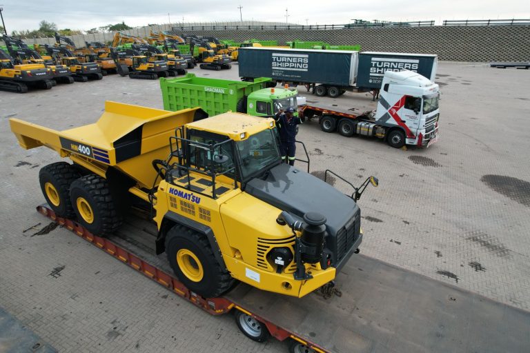 An oversized excavator transported on a specialised lowbed trailer by OneLogix Mega - leaders in abnormal truck loads.