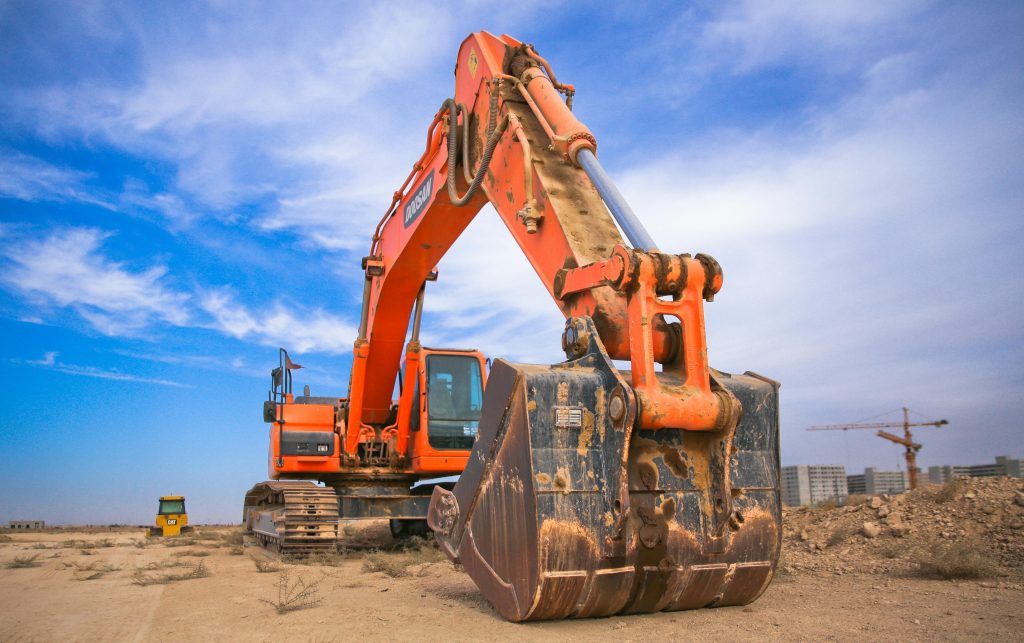 Low-bed truck transporting excavator by leading excavator haulage companies in Southern Africa.
