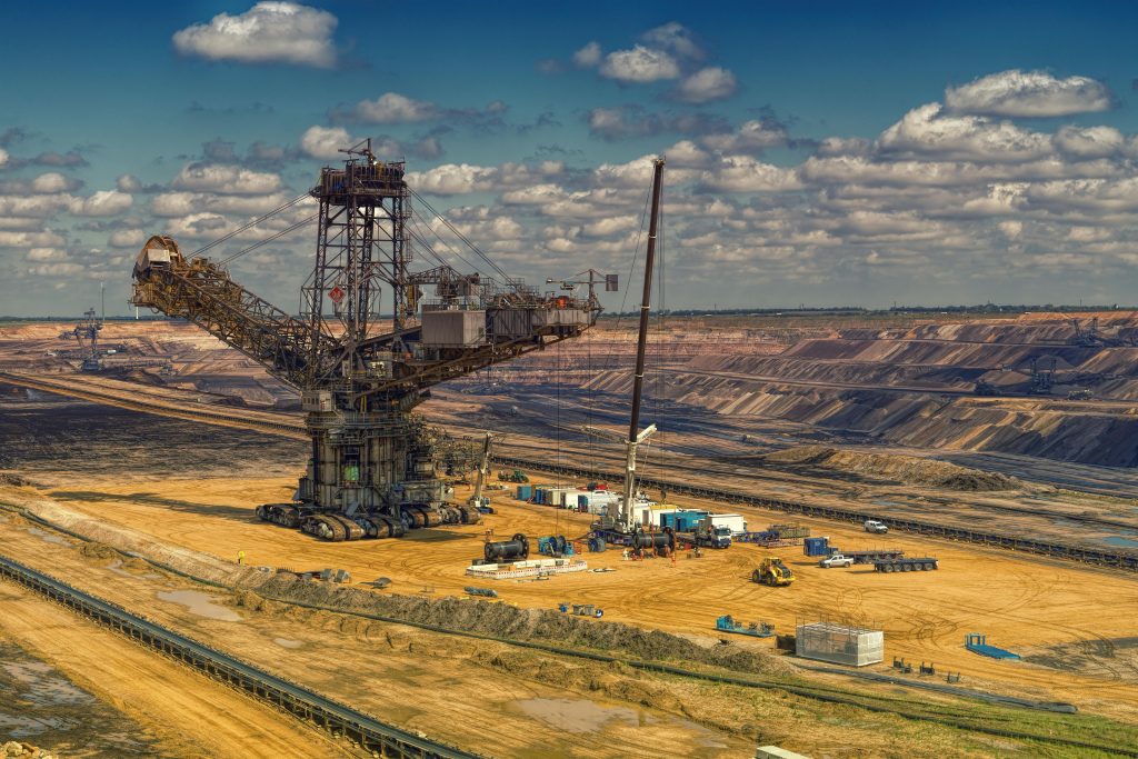 Mining machinery logistics truck transporting heavy equipment across Southern Africa.